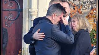 Liam Paynes parents console Simon Cowell outside One Direction singers funeral [upl. by Anwahsal100]