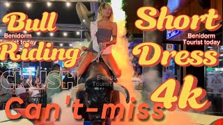 Girl 🧒 Bull 🐂 riding in short dress  Mechanical bull 🐂 riding Benidorm bull  Bull riding [upl. by Junette]