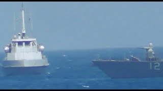 Watch as the US Navy fires warning shots toward an Iranian patrol boat [upl. by Tania]