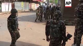 Kashmiri protesters and Indian security forces trade stones and tear gas [upl. by Thorrlow]