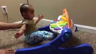 funny baby enjoying fisherprice singing stars gym as a part of baby sitting excercise [upl. by Allain]