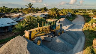 A large SDLG motor grader is pushing gravel for construction road building foundation projects [upl. by Lemuel]