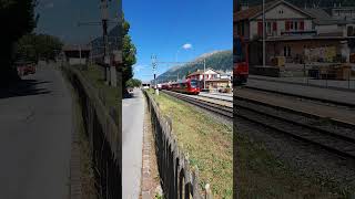 Two Rhaetian Railway trains in CelerinaSchlarigna railway station Engadin Switzerland [upl. by Eerehc]