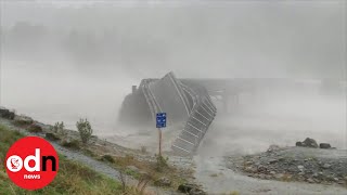 Bridge washed away by raging floodwater in New Zealand [upl. by Olegnaed]