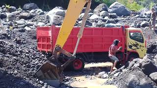 excavator working in sand mine loading small stones into dump truck  sand mining [upl. by Rennie]