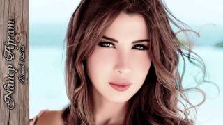 Nancy Ajram  A3mel 3a2la  EN Lyrics [upl. by Tebasile302]