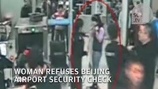 Chinese woman refuses security check at Beijing airport [upl. by Rufford406]