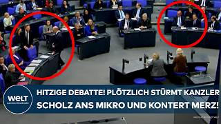 BUNDESTAG Hitzige Debatte Plötzlich stürmt Kanzler Olaf Scholz zum Mikro  und kontert Merz [upl. by Dlorrej627]