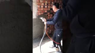 High pressure spray gun spraying process for cement mortar on interior walls [upl. by Inalawi]