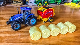 NEW HOLLAND T6180 AND ROLLBELT 560 FARM SHOW TOY 2024  164 SCALE [upl. by Obau527]