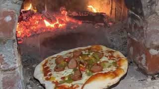 sausage and peppers pizza in a homemade outdoor wood fired oven [upl. by Solracsiul562]