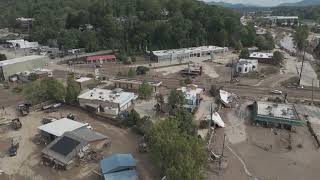 Drone footage shows muddy Asheville digging out from flooding and debris [upl. by Ixel914]