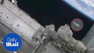 UFO spotted above astronaut as he repairs ISS  Daily Mail [upl. by Buckie]