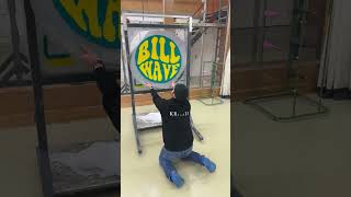 Man is tufting a custom rug with the logo for Bill Wave [upl. by Stouffer]