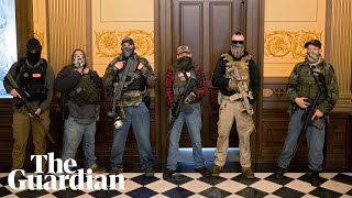 Armed protesters enter Michigans state capitol demanding end to coronavirus lockdown [upl. by Yroj]