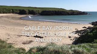 Cable bay sandy beach Porth Trecastell Isle of Anglesey is on the Anglesey Coastal Path [upl. by Henriette958]