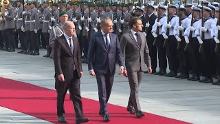 Scholz Macron and Tusk in Berlin for Ukraine talks  AFP [upl. by Drooff112]