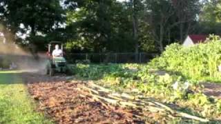 Tilling Sunflowers with a JD 2305 [upl. by Faires607]